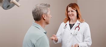 Patient talking with a doctor in a QuadMed clinic